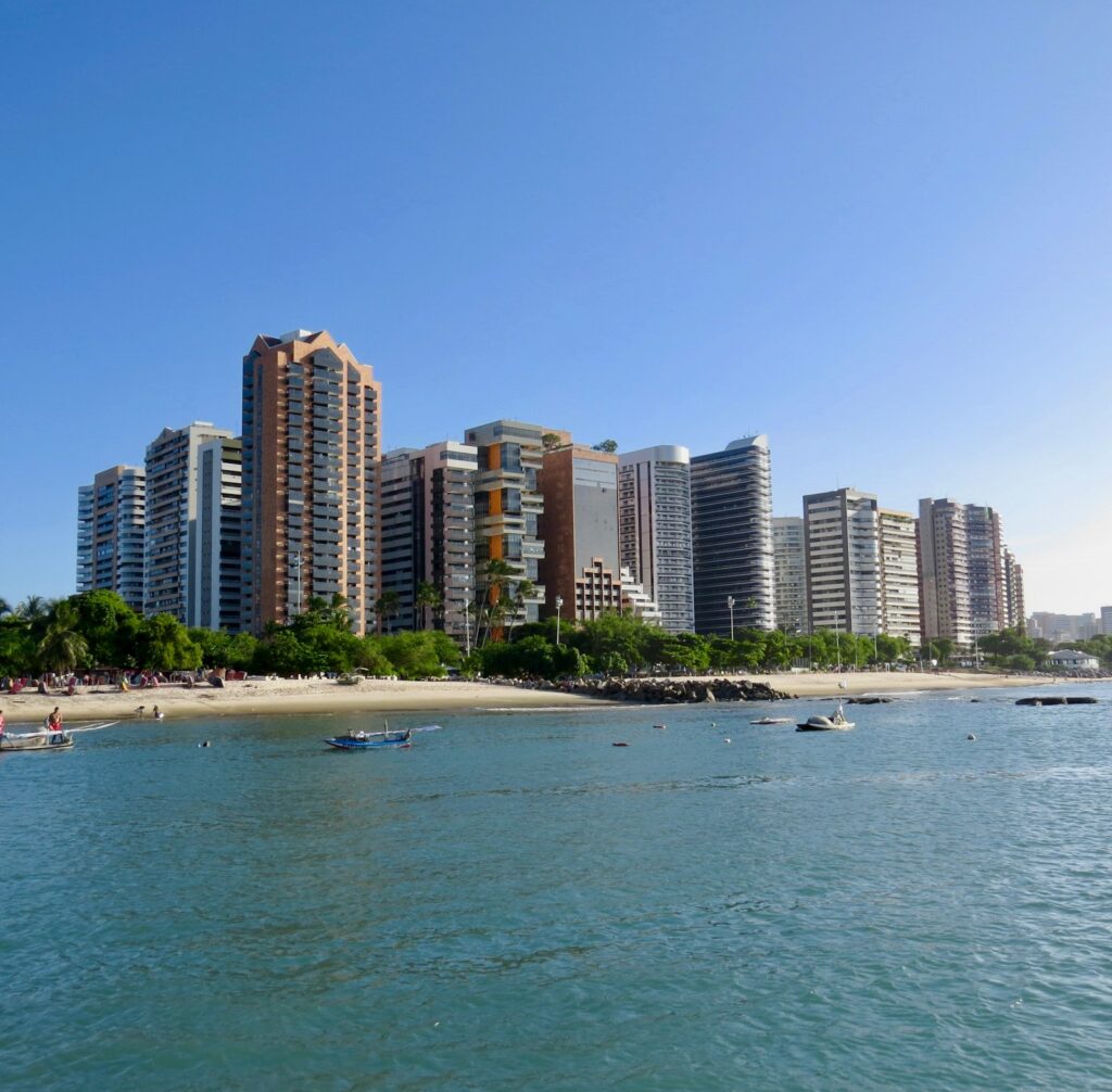 Fortaleza's beachfront high-rises seen from the water, by Jaime Dantas