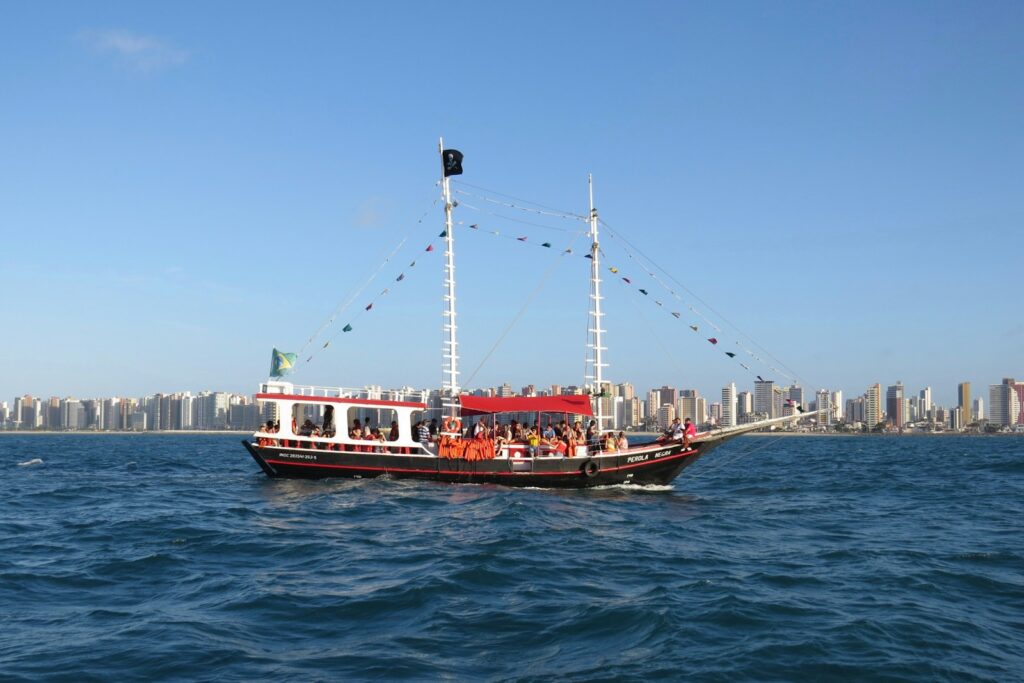 A ship offshore with the Fortaleza skyline behind, by Jaime Dantas