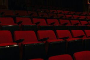 Rows of red velvet cinema seats, evoking the S&atilde;o Paulo International Film Festival