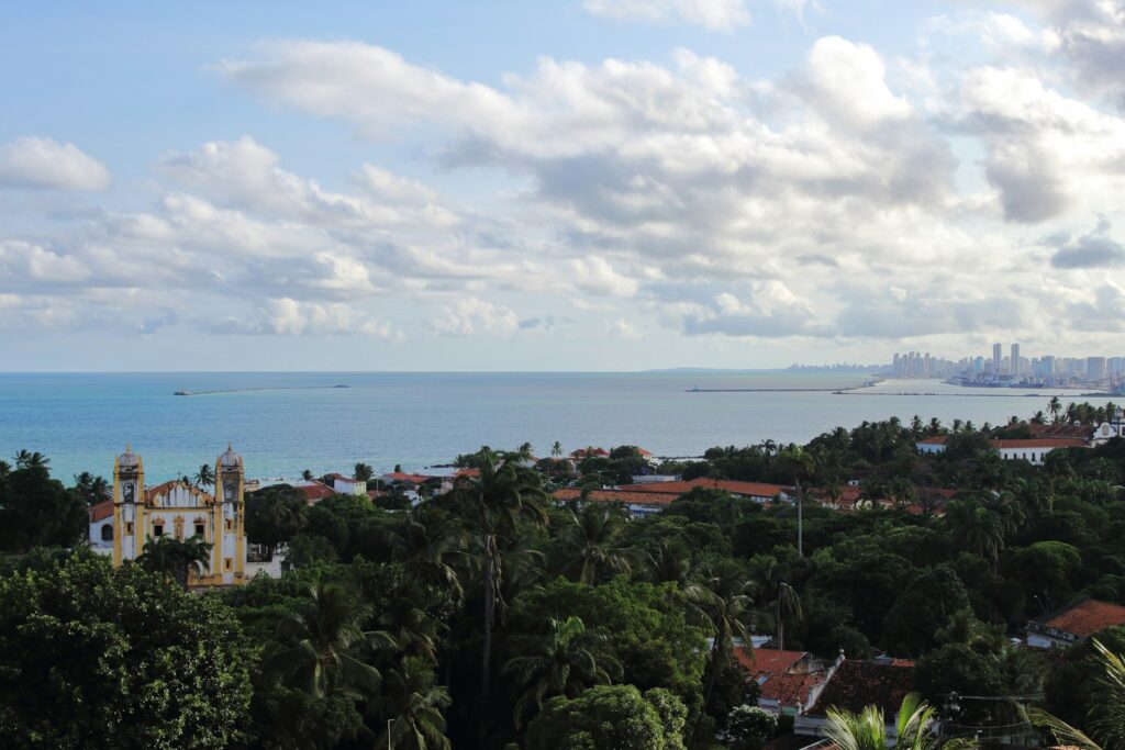 Historic buildings of Olinda with the ocean beyond, by Marcelo de Souza Rom&atilde;o
