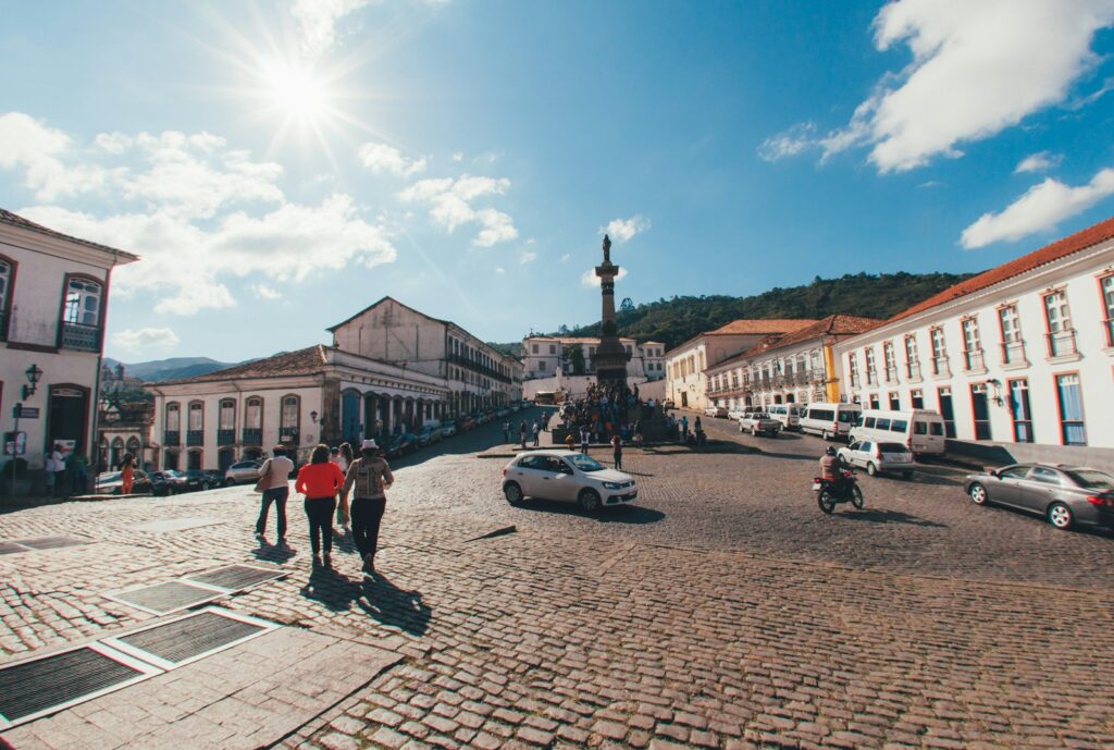 Visitors on the cobbled Pra&ccedil;a Tiradentes in Ouro Preto, by Mario Gogh
