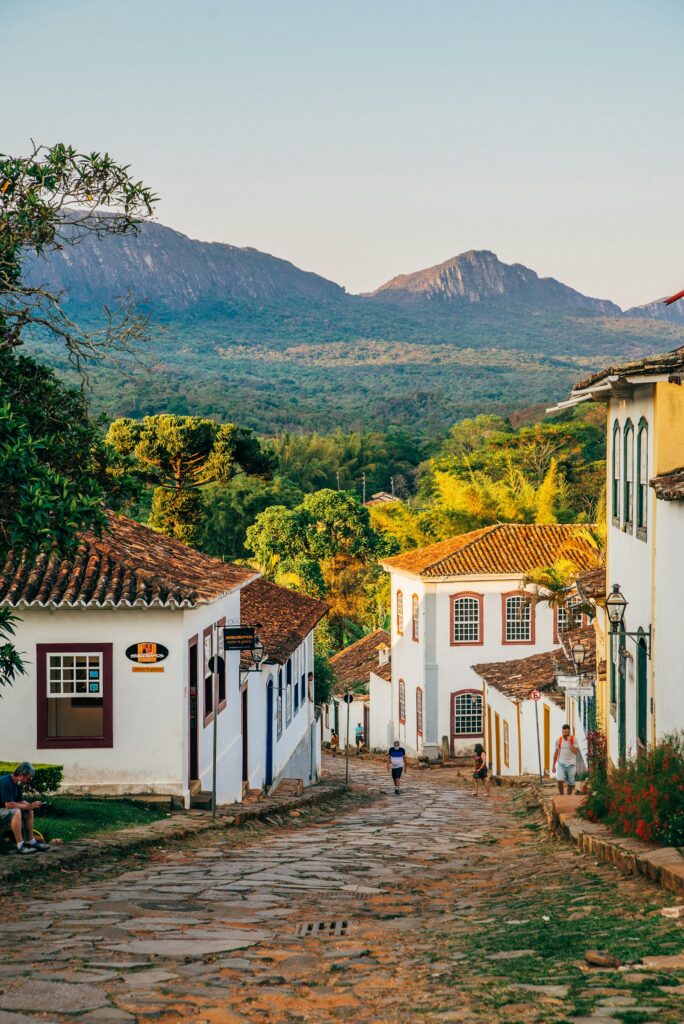 Cobbled street with whitewashed colonial houses in the historic centre of Tiradentes, by Nathalia Segato