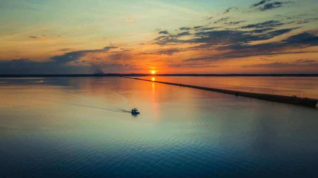A small boat on the lake at sunset, Palmas, by Anderson Mathias