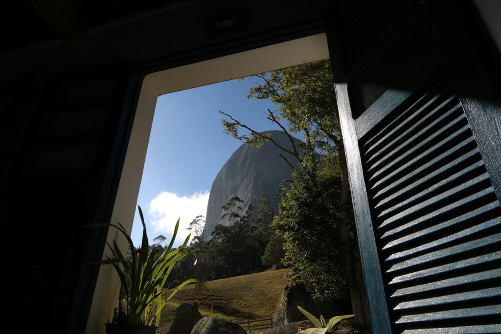 Mountain view framed by a window in Domingos Martins, by Marcus Dall Col