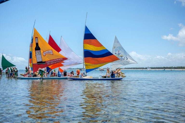 Jangadas carrying visitors across the water at Porto de Galinhas, by Mayumi Maciel