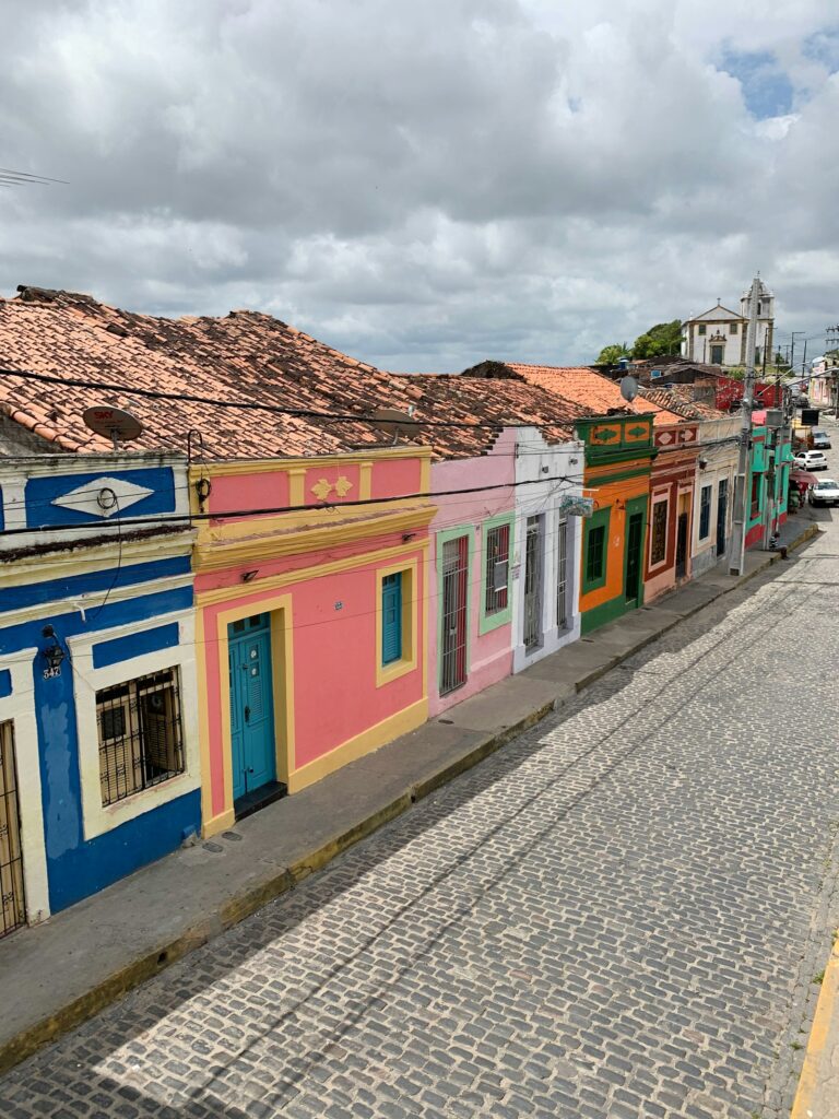 Colourful colonial houses on a cobbled street in Olinda, Pernambuco, by Secret Travel Guide