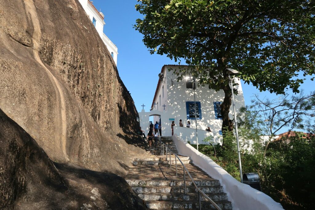 Visitors climbing the steps at the Convento da Penha, Vila Velha, by Nivaldo Martins