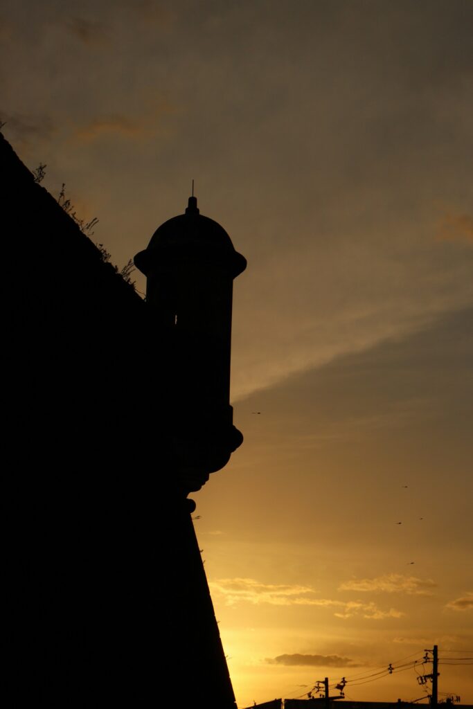 Backlit sunset view of a historic tower in Macap&aacute;, by Cassio Magno