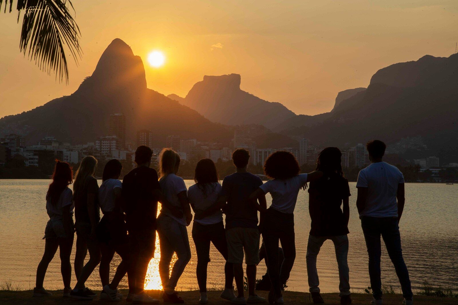 people standing near body of water