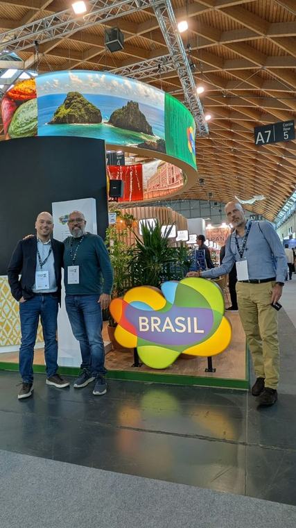 The Brasil national pavilion at TTG Travel Experience in Rimini, with Fernando de Noronha imagery on the overhead ring